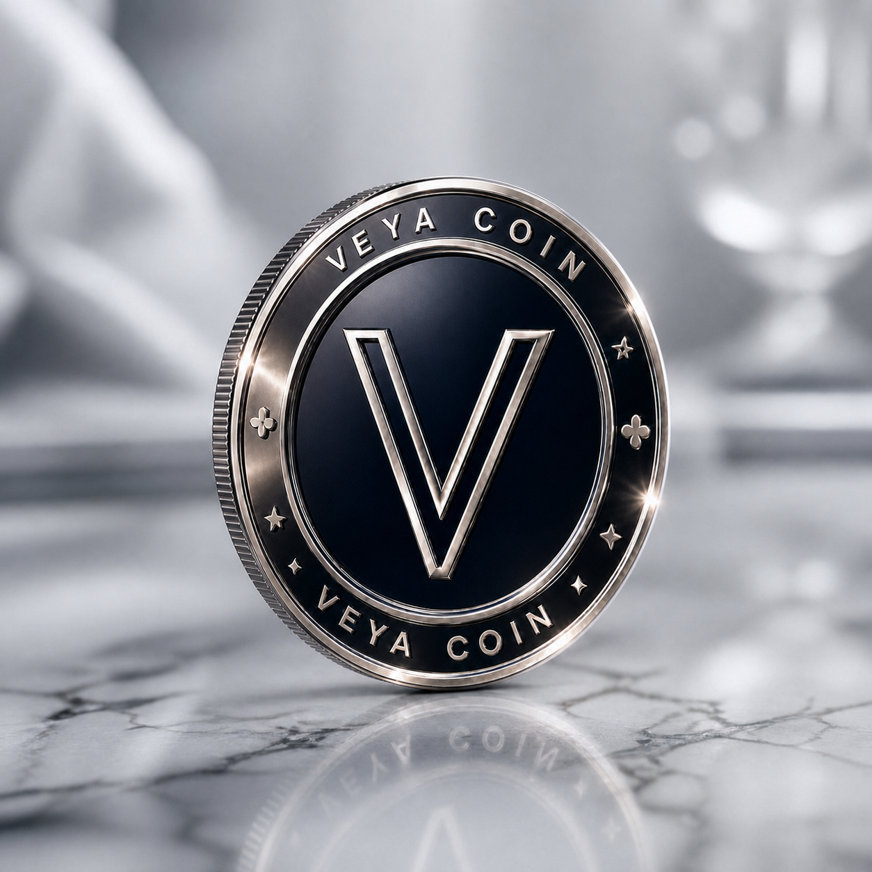 A polished reflective silver VEYA Loyalty Coin engraved with the letter V